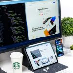 Laptop showing a modern website layout on a desk